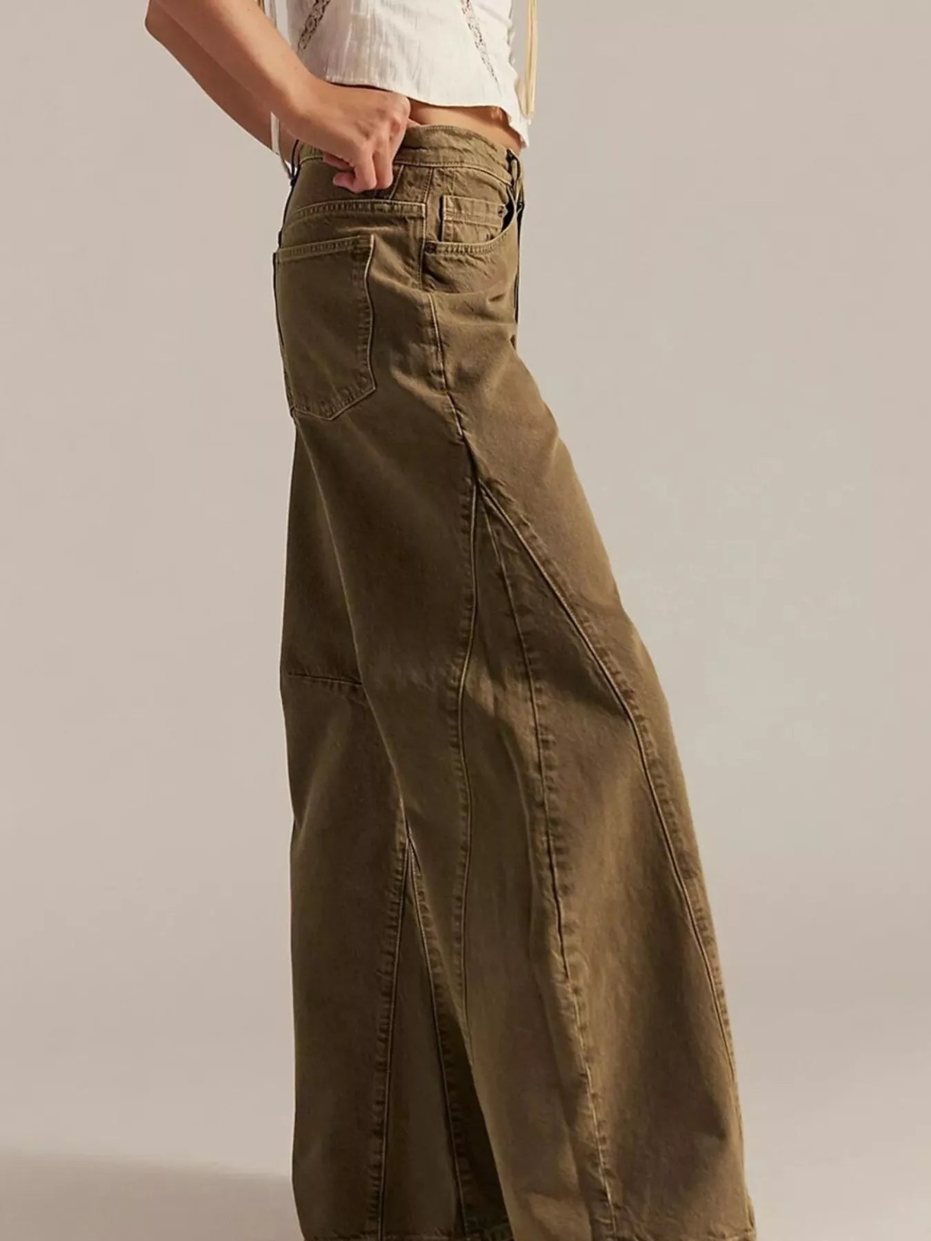 Brown wide-leg pants worn by a person on a plain background