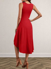 Red dress worn by a person on a plain background