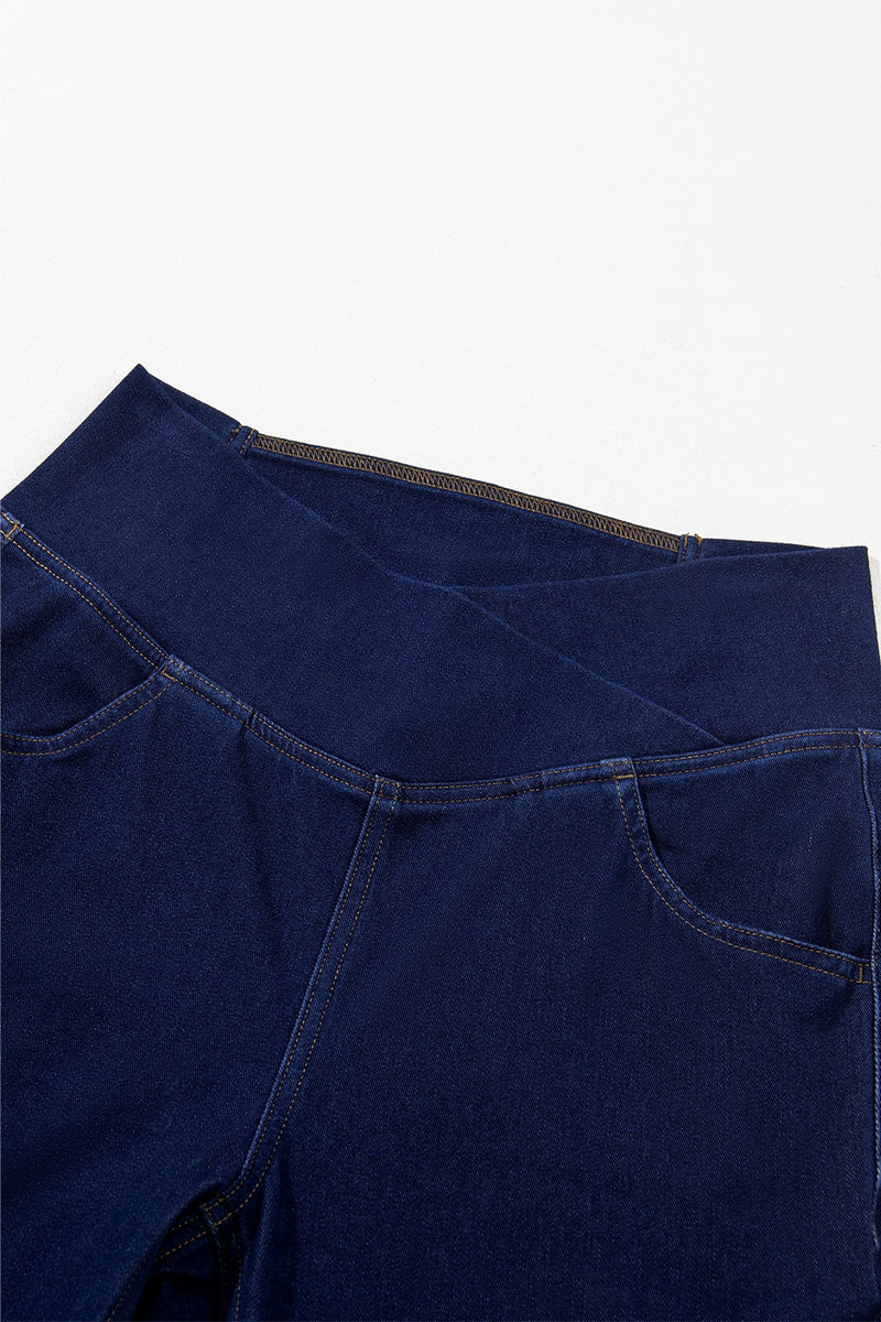 Stack of blue jeans on a white background