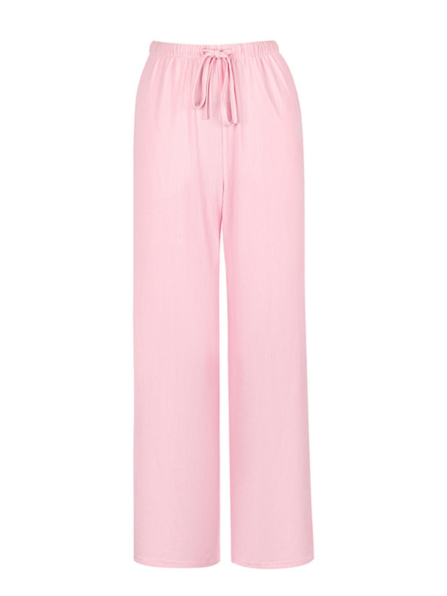 Pink pajama pants on a white background