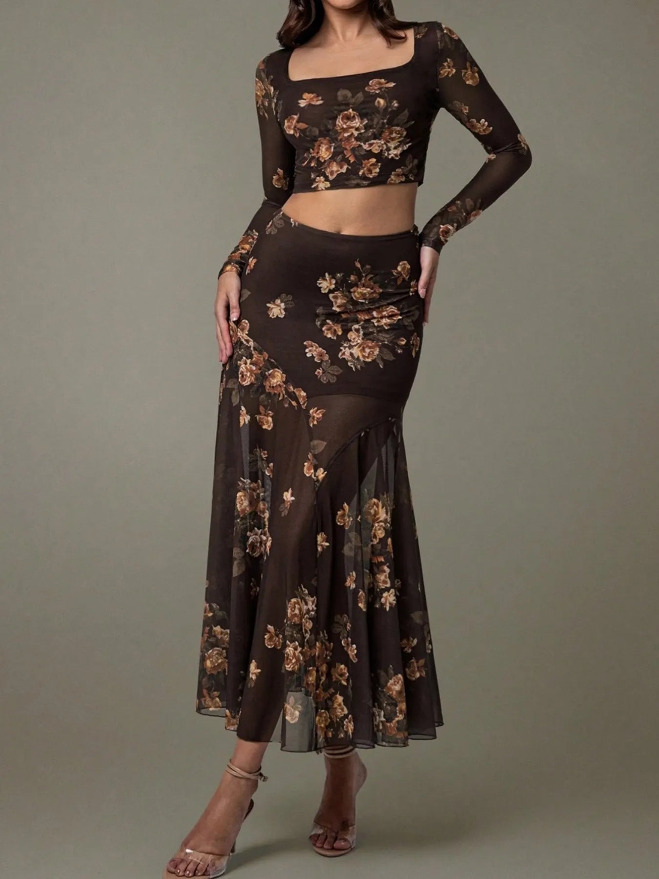 Black floral two-piece outfit on a model against a gray background