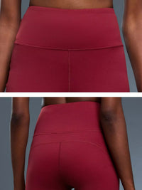 Red leggings worn by a person on a gray background