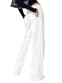 White wide-leg jeans worn by a person on a white background