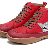 Red high-top sneakers with brown laces and a unique design on a white background