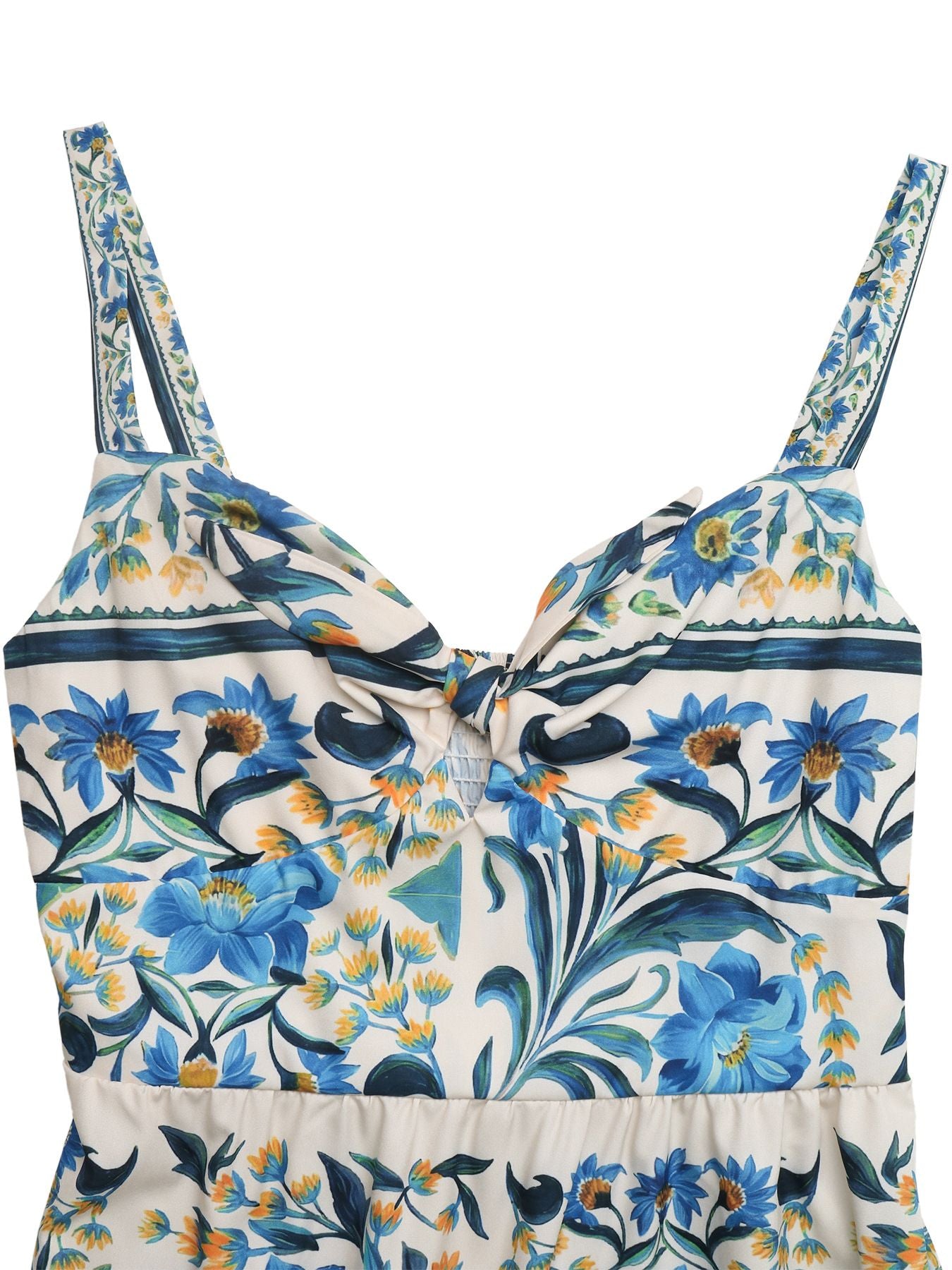 Floral patterned top with blue and green flowers on a white background