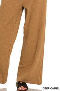 Close-up of deep camel pants on a white background