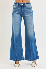Blue flared jeans on a white background