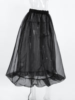 Black sheer petticoat on a mannequin against a white background