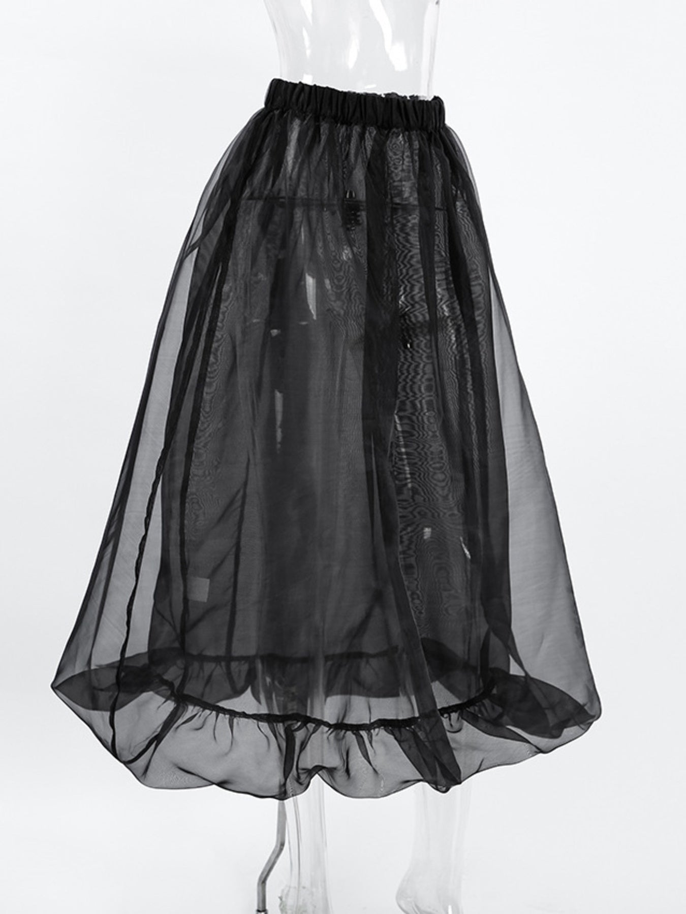 Black sheer petticoat on a mannequin against a white background