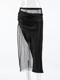 Black skirt with sheer overlay on a white background