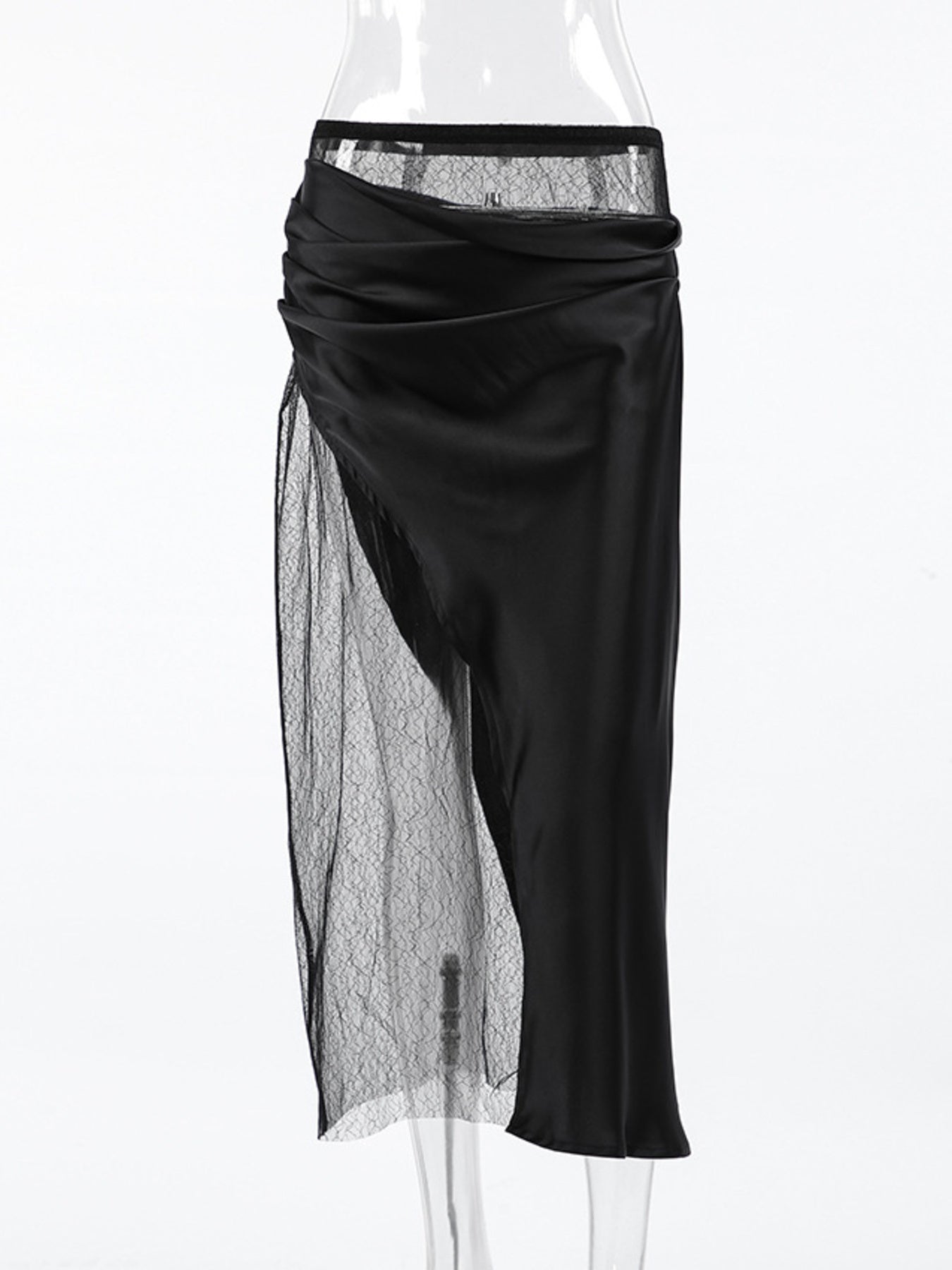 Black skirt with sheer overlay on a white background