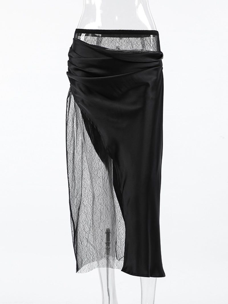 Black skirt with sheer overlay on a white background