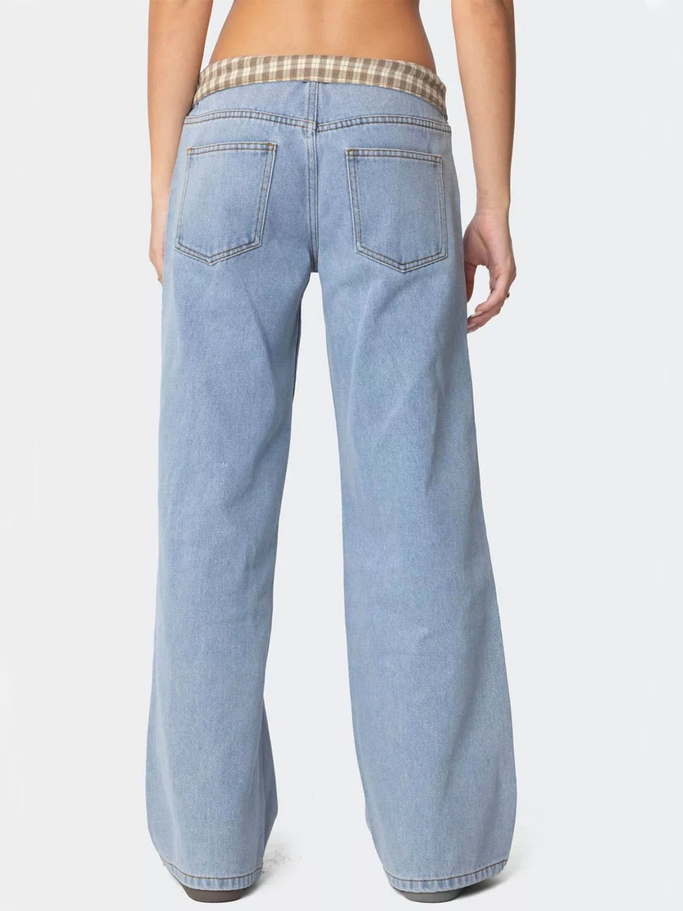 Light blue jeans worn by a person on a white background