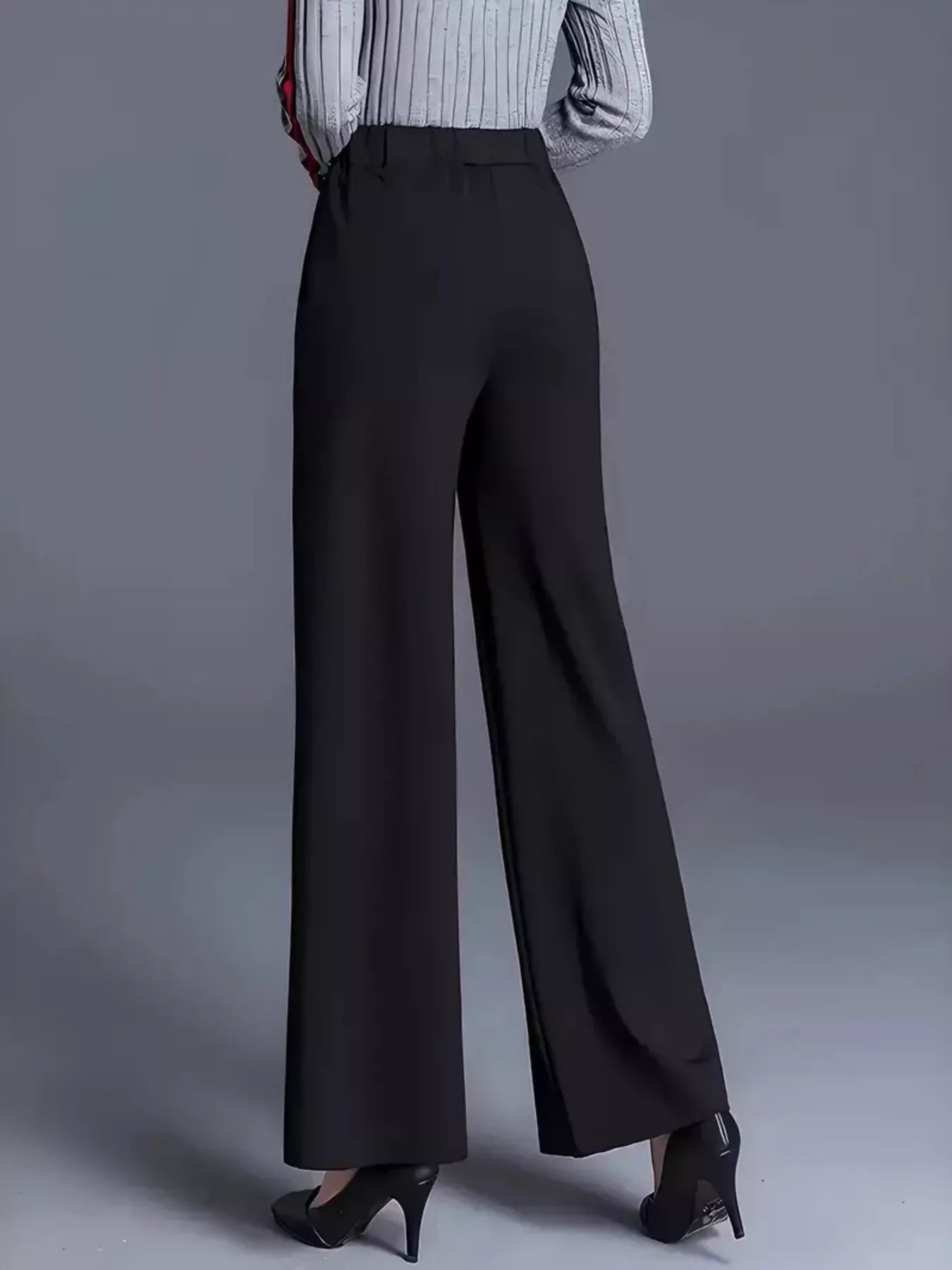 Black wide-leg pants worn by a person on a gray background