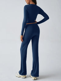 Person wearing a navy blue athletic outfit on a light gray background