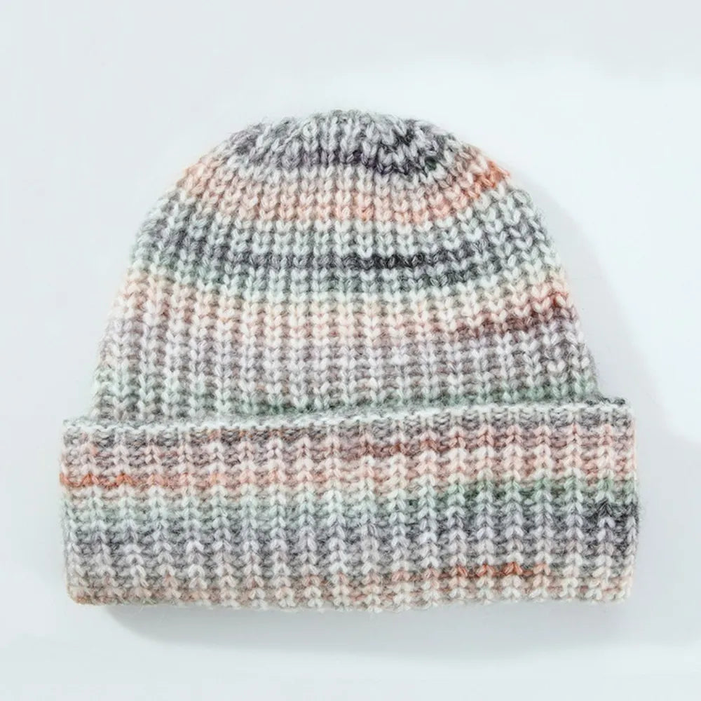 Multicolored knit beanie on a white background