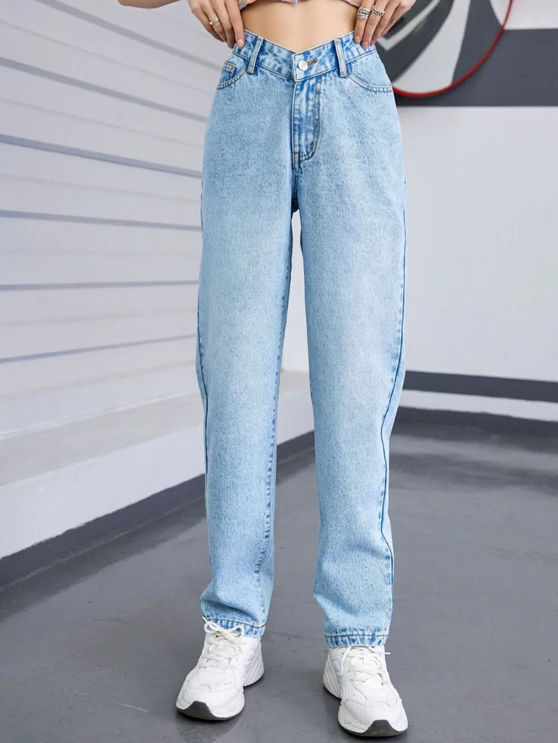 Light blue jeans worn by a person in an indoor setting with a neutral background