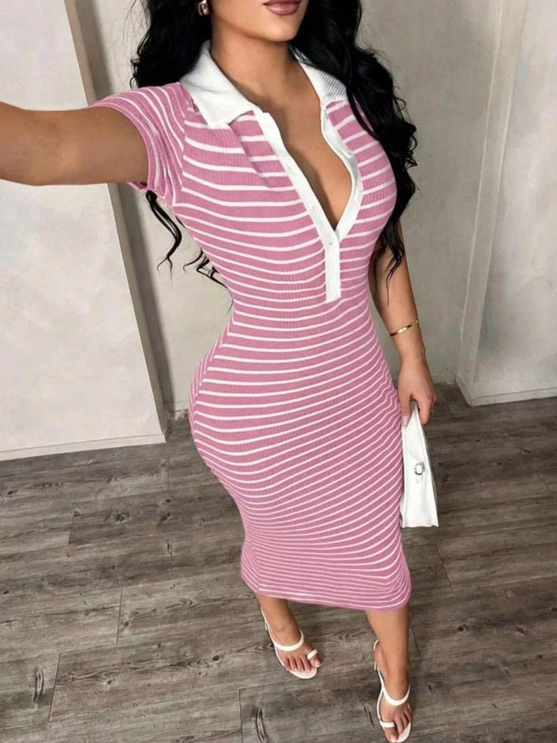 Woman wearing a pink and white striped dress with a deep neckline.