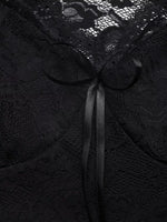 Black lace fabric with a ribbon bow