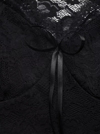 Black lace fabric with a ribbon bow
