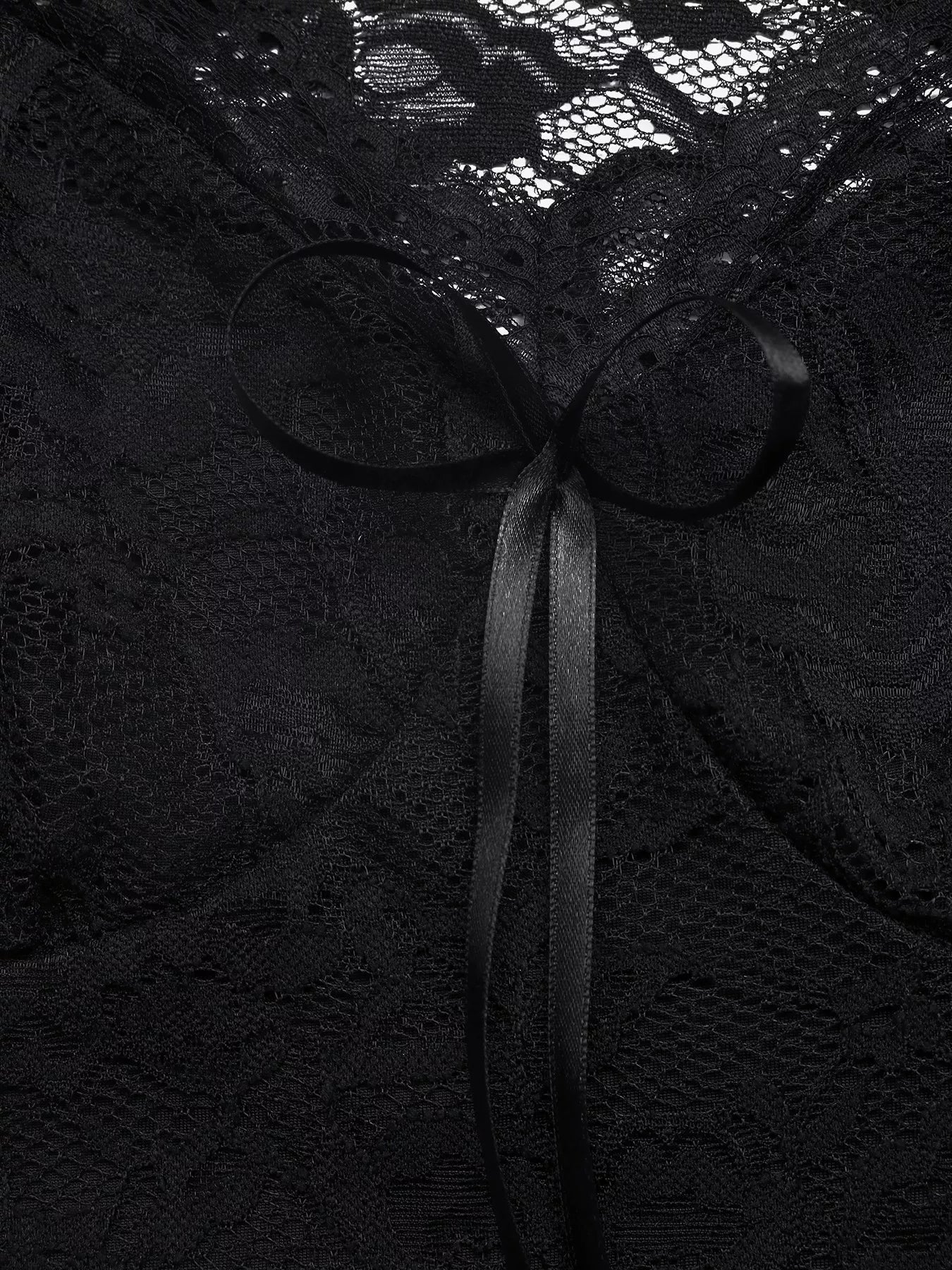 Black lace fabric with a ribbon bow