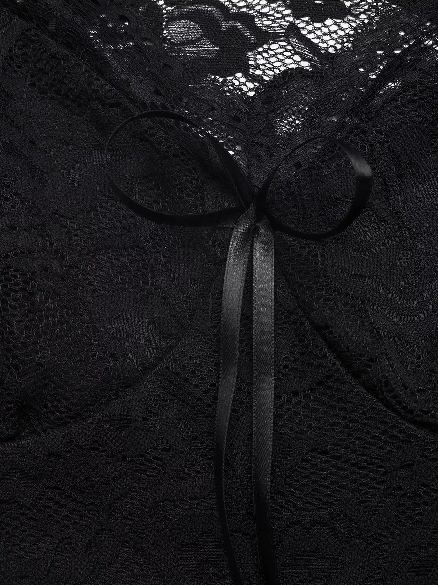 Black lace fabric with a ribbon bow