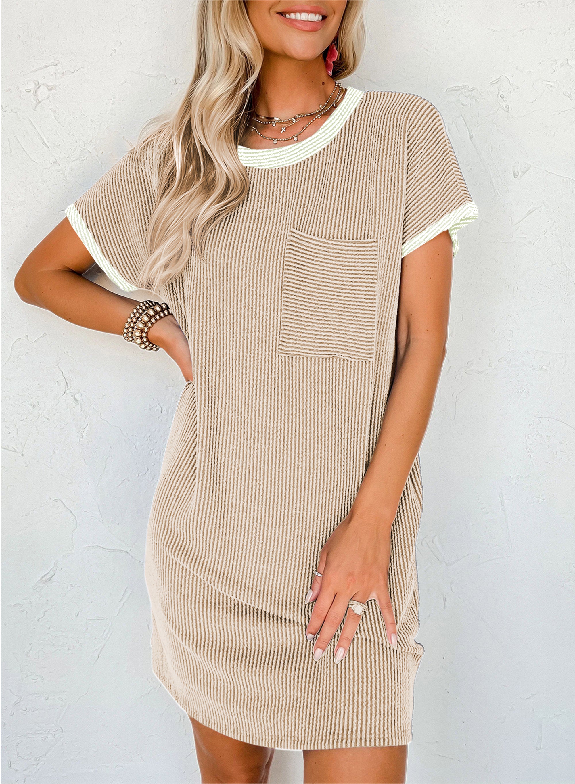 Woman wearing a beige and white striped dress against a white background