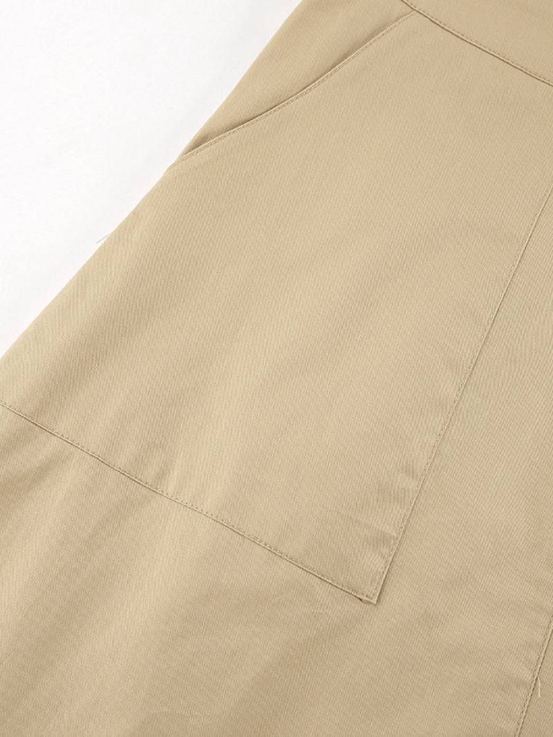 Close-up of beige pants with a pocket on a white background