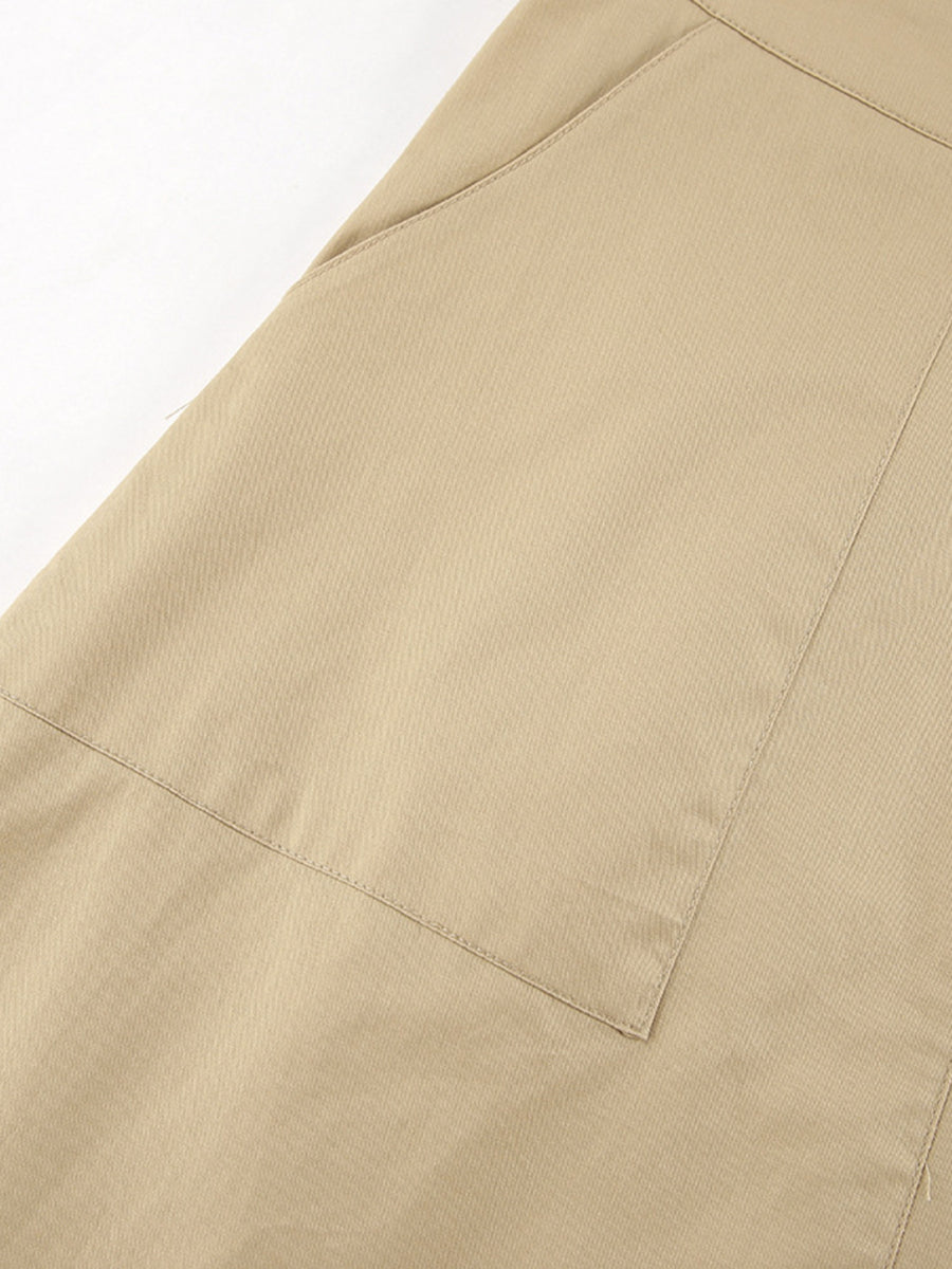 Close-up of beige pants with a pocket on a white background