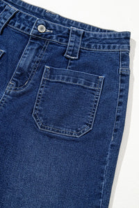 Close-up of blue jeans with a pocket on a white background