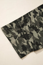 Camouflage-patterned pants on a light beige background