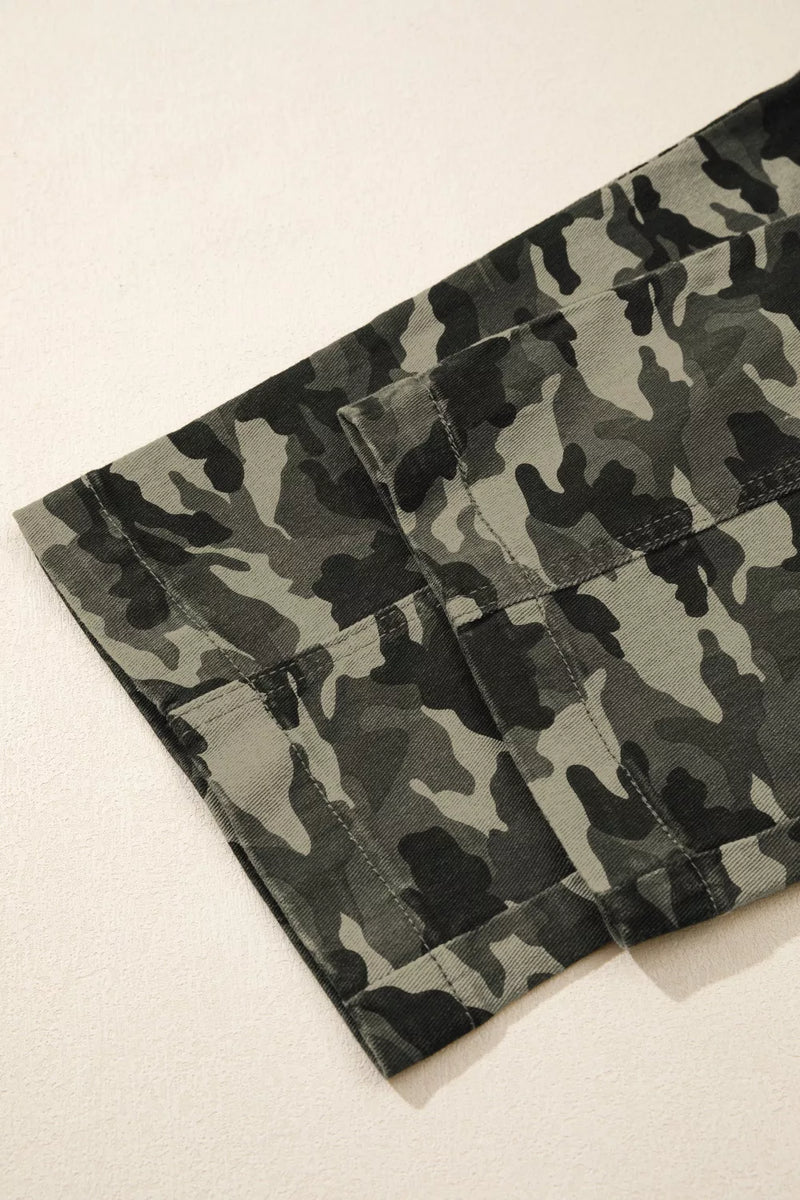 Camouflage-patterned pants on a light beige background