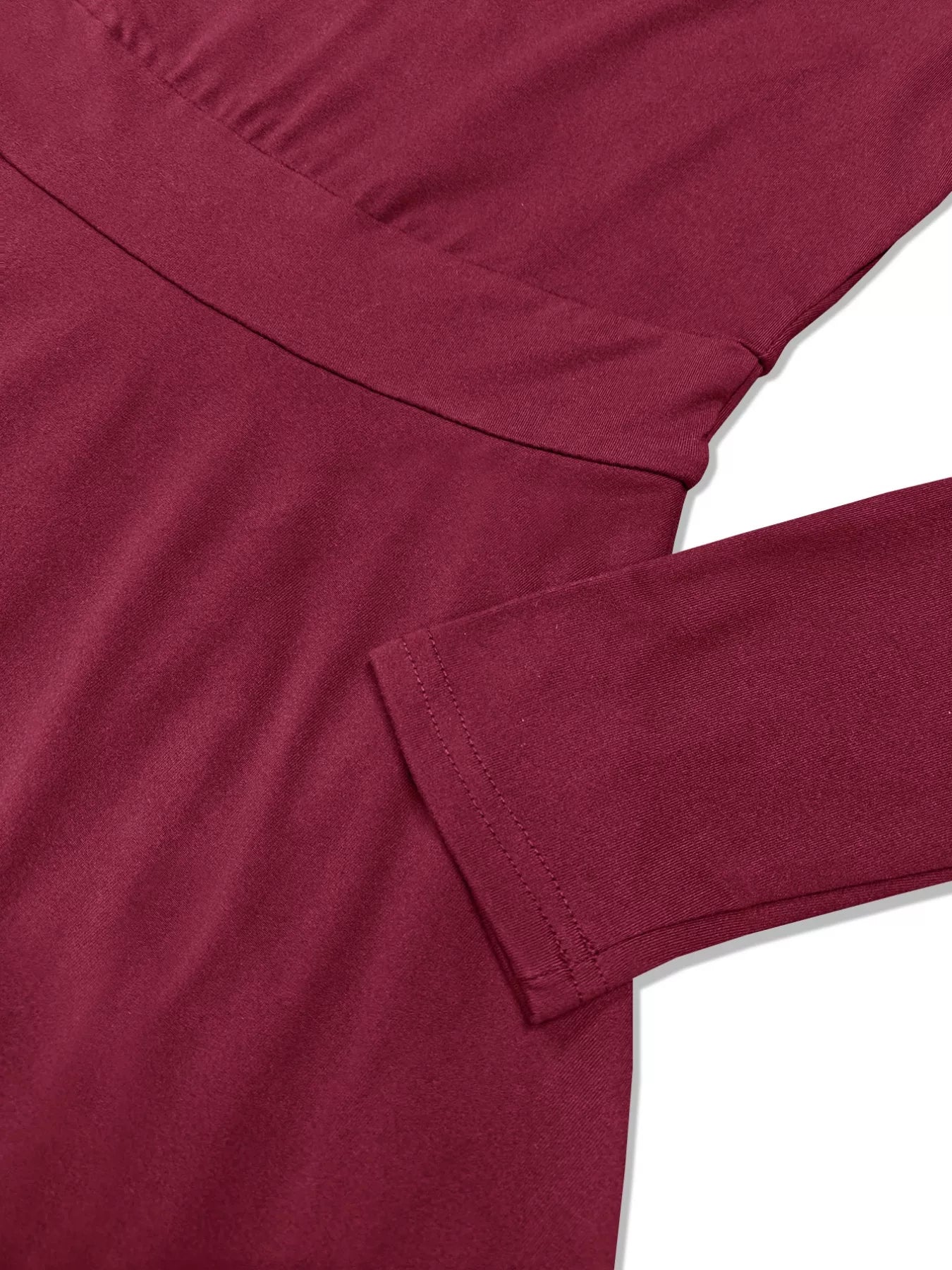 Close-up of a maroon shirt with a white background