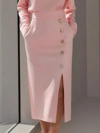 Pink skirt with button details on a plain background