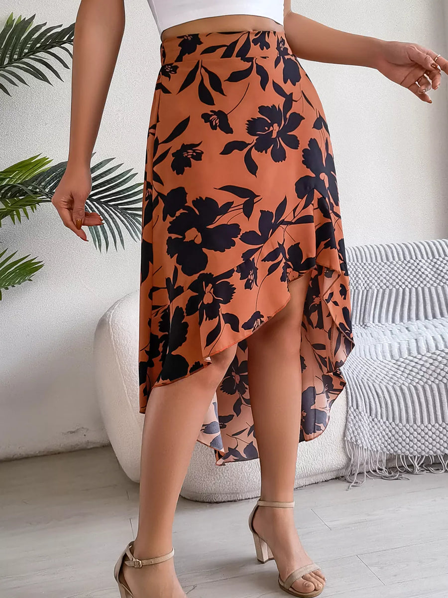 Person wearing a floral skirt with a white background