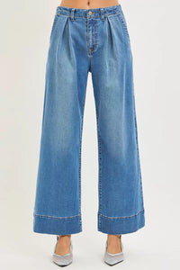 Blue wide-leg jeans on a white background
