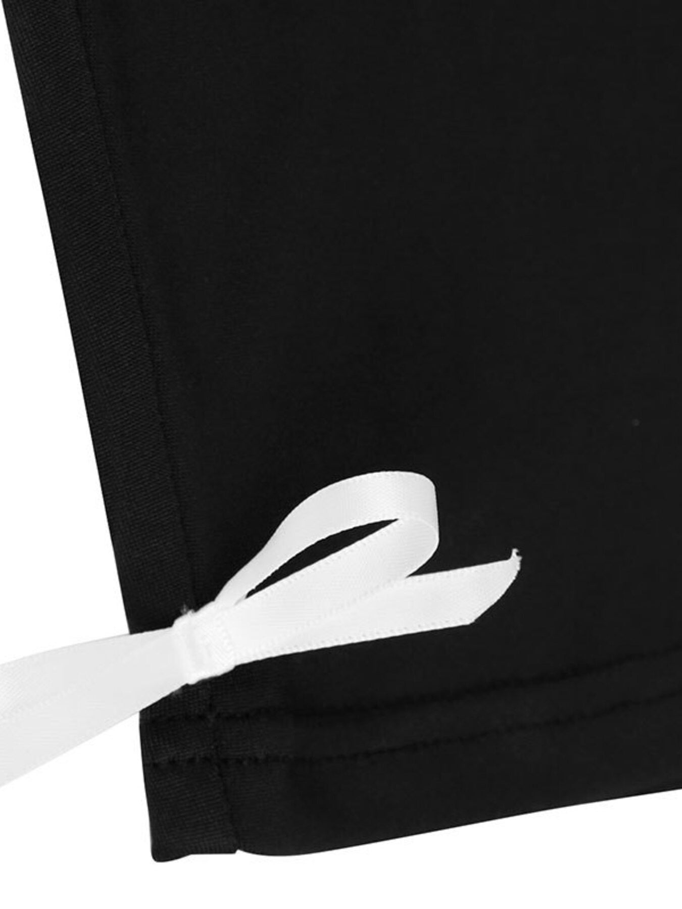 Close-up of a black fabric with a white ribbon tied around it.