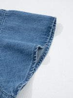 Close-up of blue denim fabric on a white background