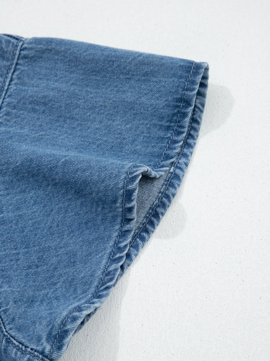 Close-up of blue denim fabric on a white background