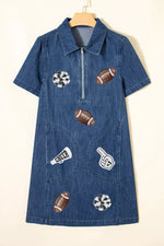 Blue denim dress with sports-themed patches on a beige background