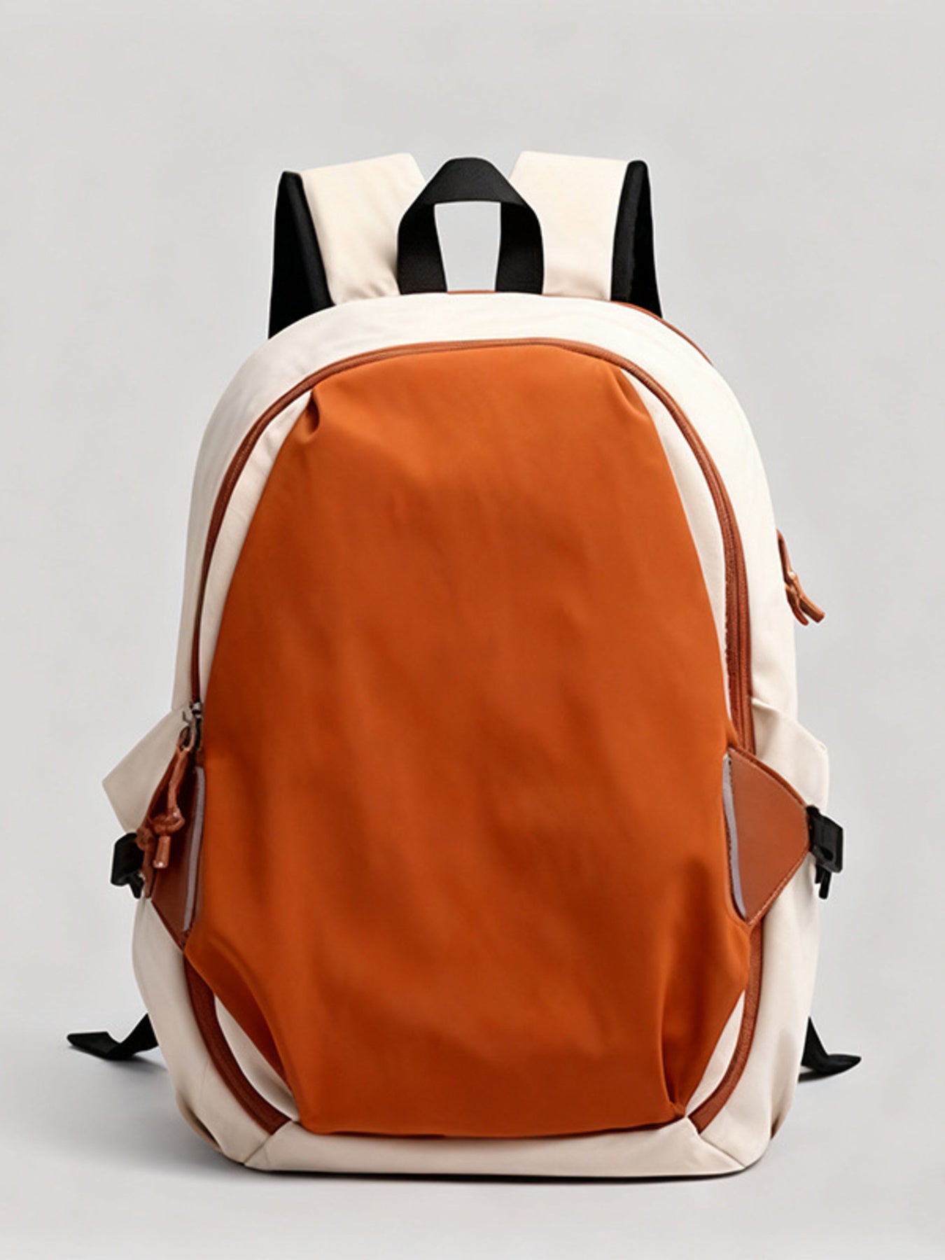 Backpack with orange front compartment and white sides on a light gray background