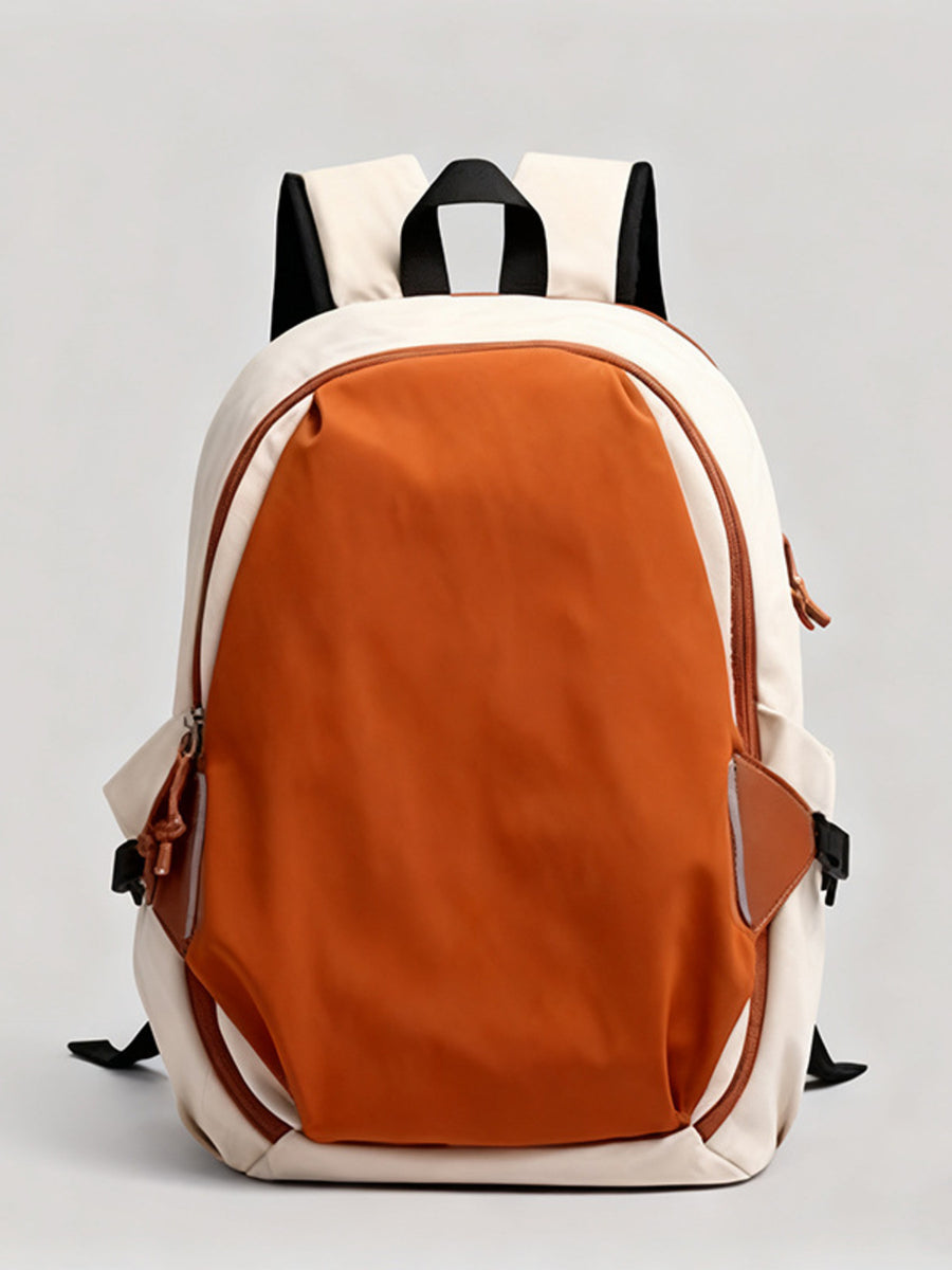 Backpack with orange front compartment and white sides on a light gray background