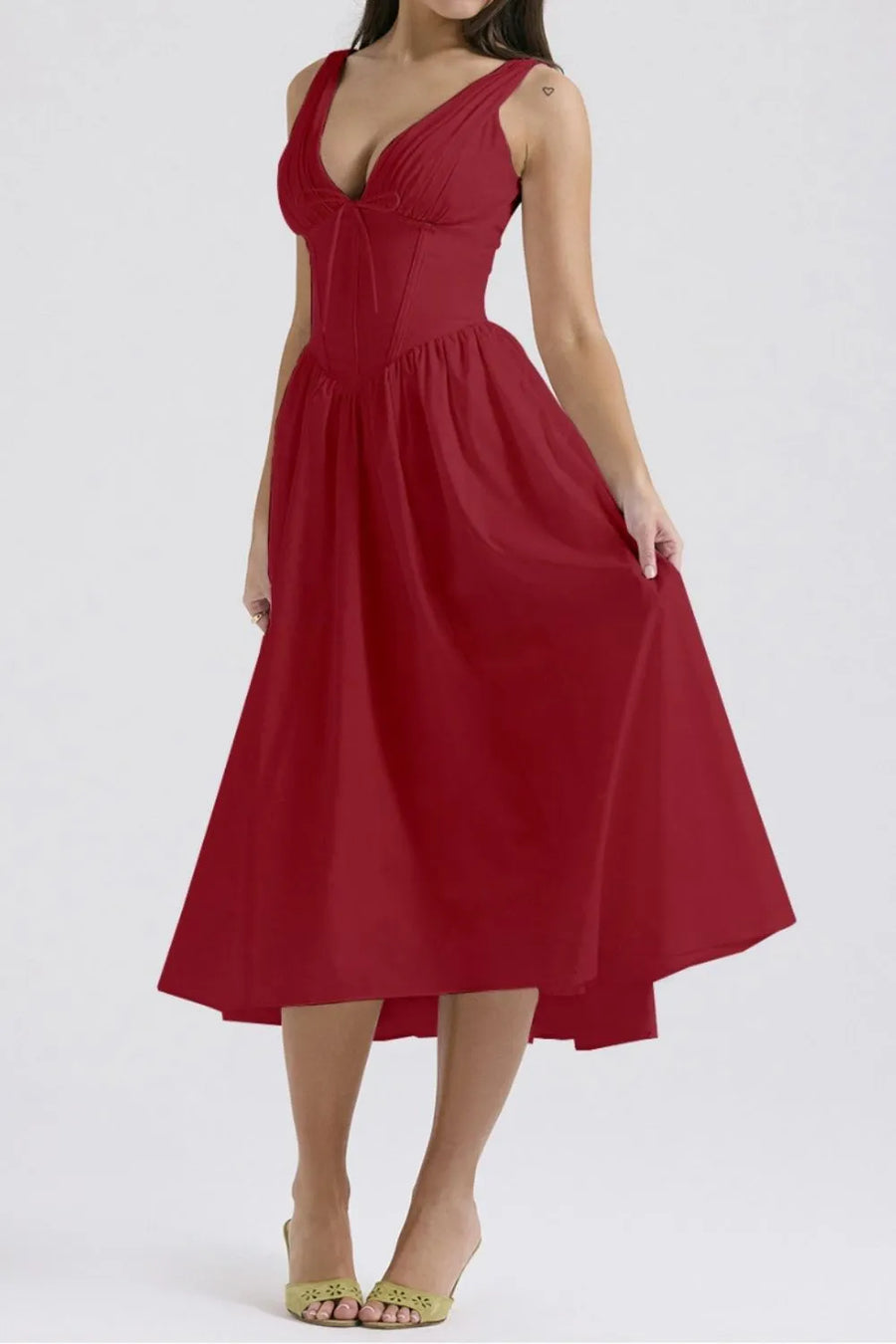 Red dress worn by a model on a white background