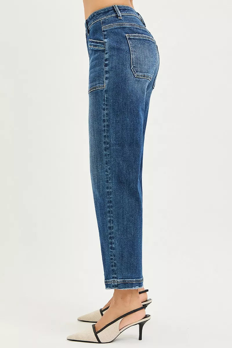 Blue jeans worn by a person on a white background