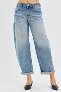 Light blue jeans worn by a person on a white background