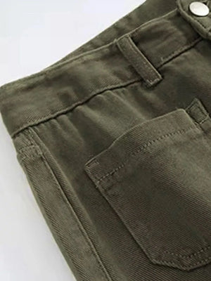 Close-up of green pants with a button on a white background