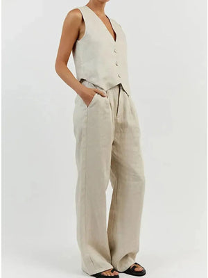 Person wearing a beige sleeveless jumpsuit on a white background