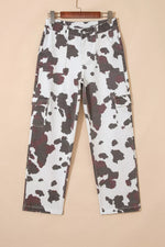Cow print pants on a beige background
