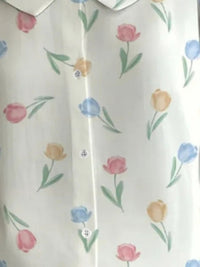Floral patterned shirt with colorful tulips on a white background