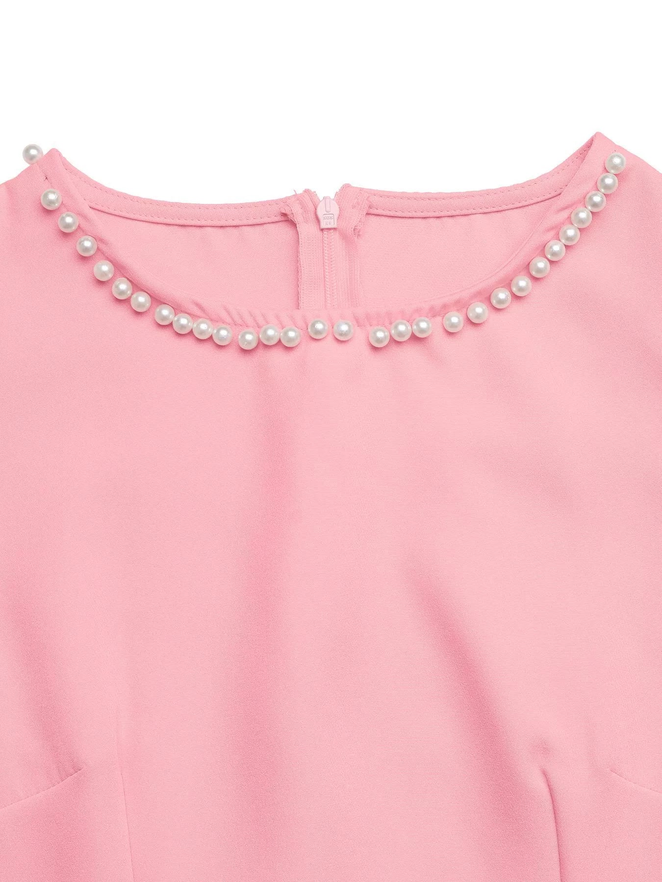 Pink dress with pearl embellishments on a white background